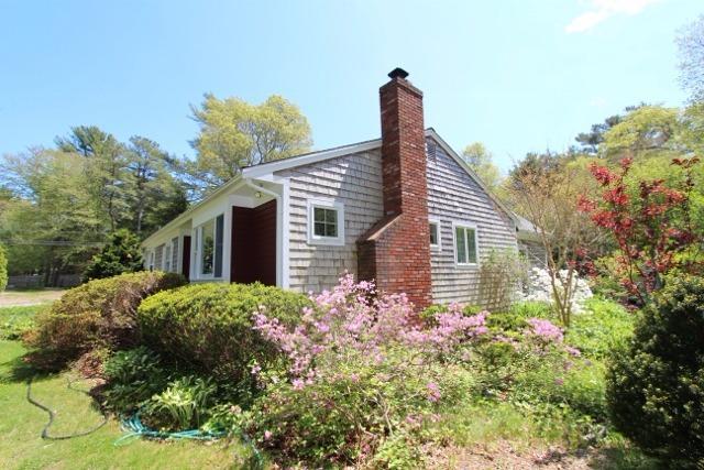 19 Taramac Road Centerville, MA 02632 - Photo 2 of 4 a front view of a house with garden