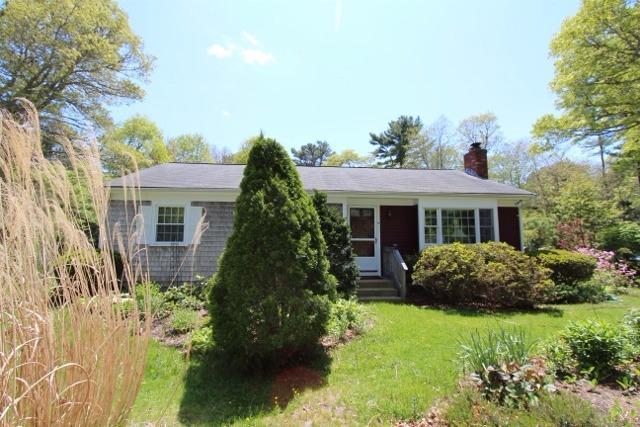 19 Taramac Road Centerville, MA 02632 - Photo 3 of 4 a front view of a house with garden