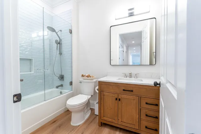 a bathroom with a toilet a sink and a bathtub