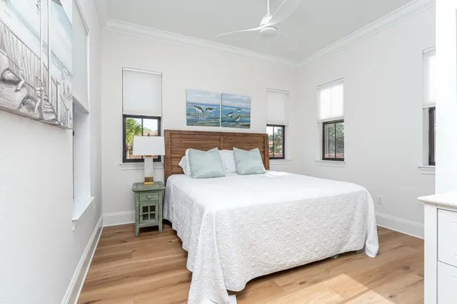 a bedroom with a bed and a night stand