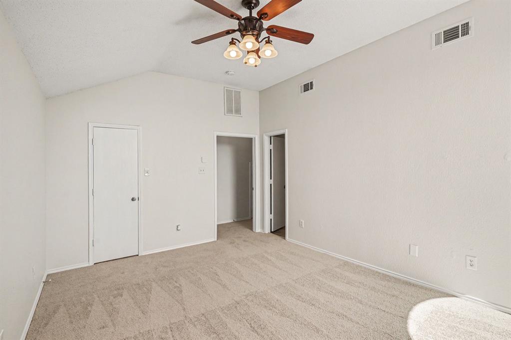 2541 Rivers Edge Drive Fort Worth, TX 76118 - Photo 21 of 31 a view of a room with cabinet and a ceiling fan