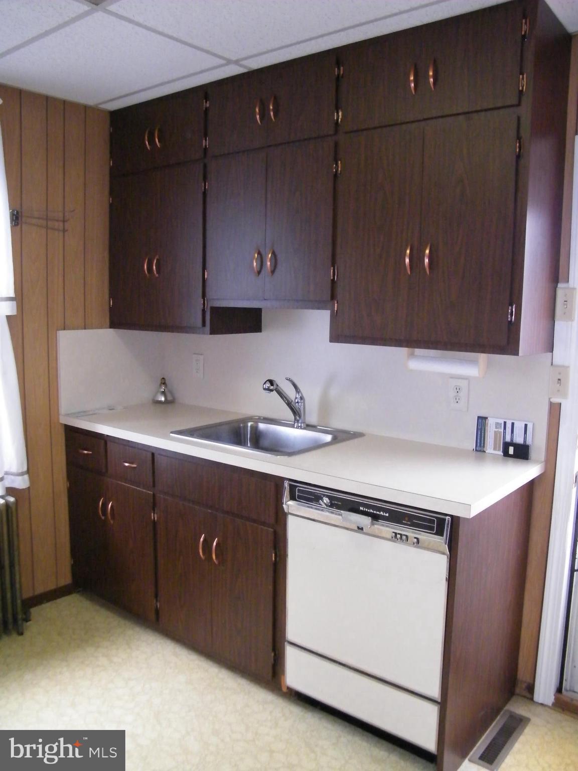 7602 Old Harford Road Parkville, MD 21234 - Photo 16 of 48 a kitchen with a sink and cabinets