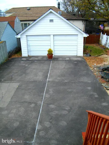 a view of a house with a yard and garage