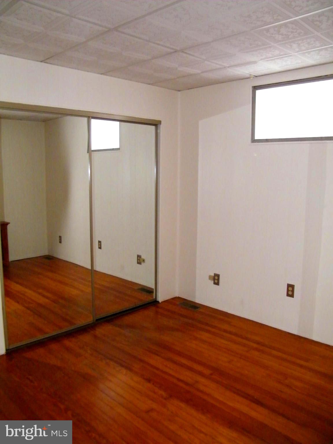 7602 Old Harford Road Parkville, MD 21234 - Photo 32 of 48 a view of empty room with wooden floor