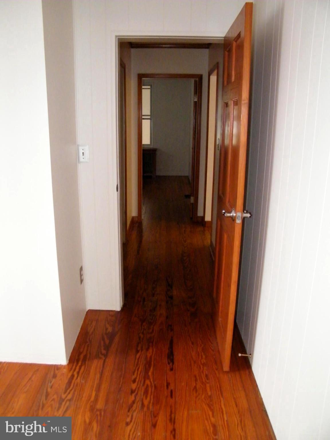 7602 Old Harford Road Parkville, MD 21234 - Photo 47 of 48 a view of a hallway with wooden floor