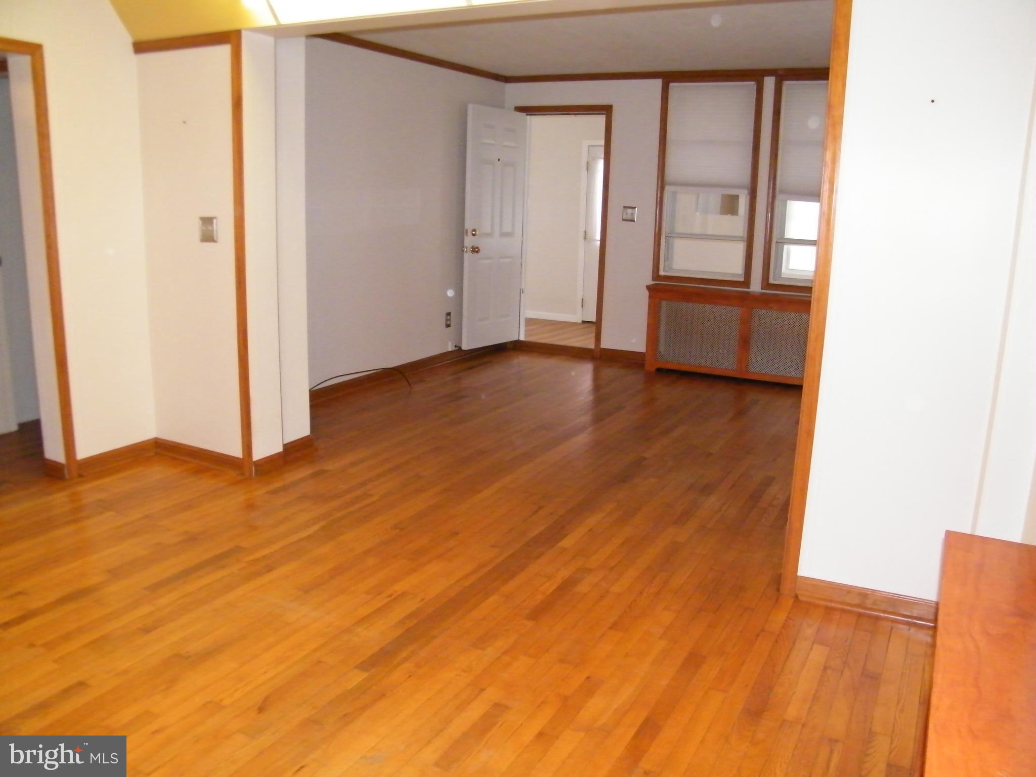 7602 Old Harford Road Parkville, MD 21234 - Photo 10 of 48 an empty room with wooden floor and closet