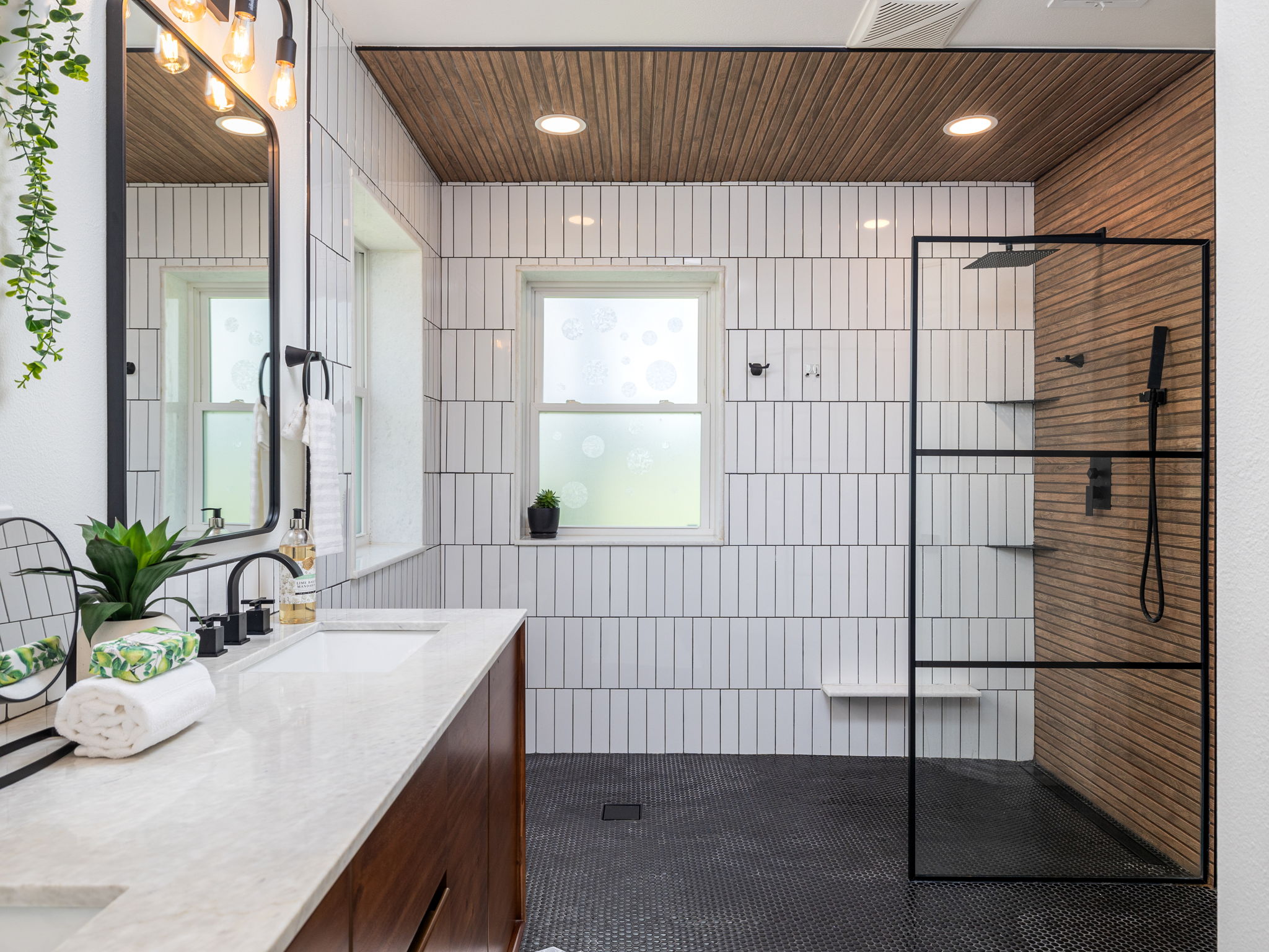 3001 County Road 255 Georgetown, TX 78633 - Photo 16 of 35 A well-appointed bath boasts a sleek vanity and a spacious shower with wood accents.