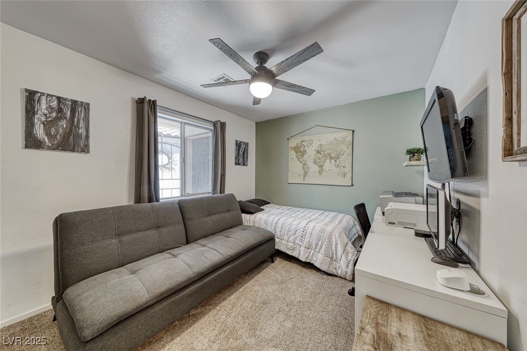 990 Ridge Path Avenue Henderson, NV 89015 - Photo 19 of 41 Carpeted bedroom with a ceiling fan