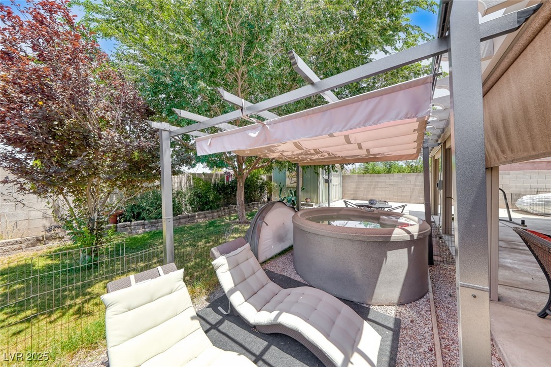 990 Ridge Path Avenue Henderson, NV 89015 - Photo 29 of 41 Fenced backyard with a pergola, a storage unit, and a patio