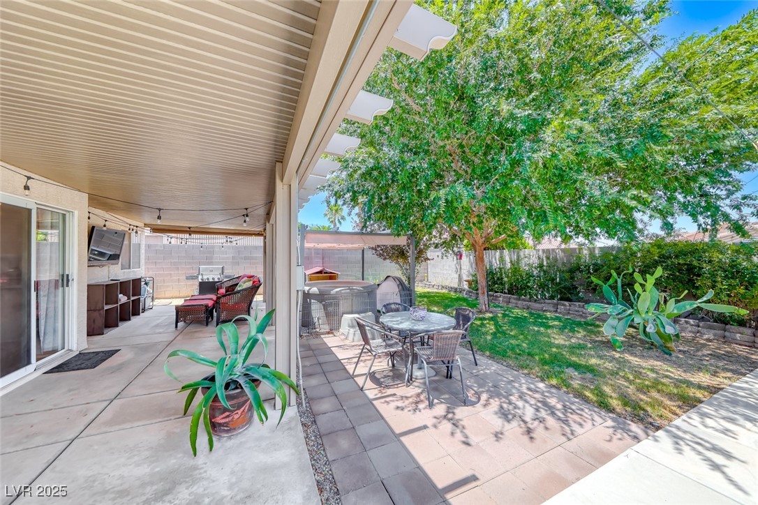 990 Ridge Path Avenue Henderson, NV 89015 - Photo 30 of 41 Fenced backyard featuring outdoor dining area and a patio