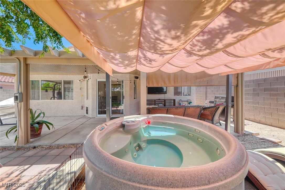 990 Ridge Path Avenue Henderson, NV 89015 - Photo 34 of 41 View of pool with a hot tub and a patio