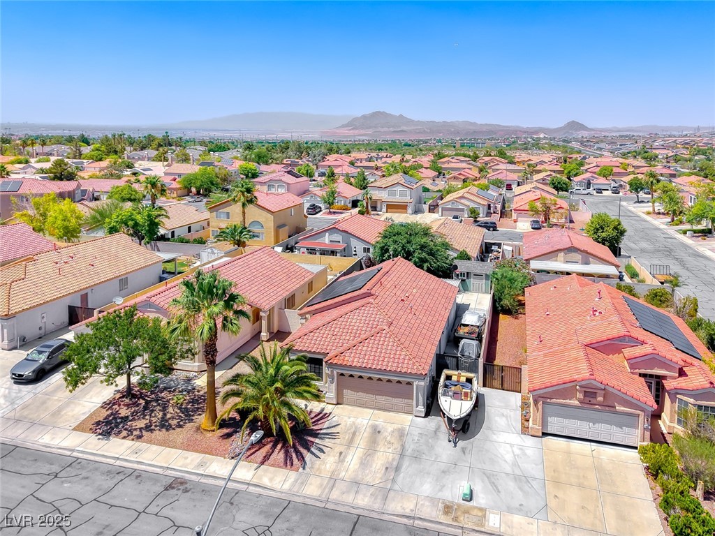 990 Ridge Path Avenue Henderson, NV 89015 - Photo 36 of 41 Aerial view of residential area featuring a mountain backdrop