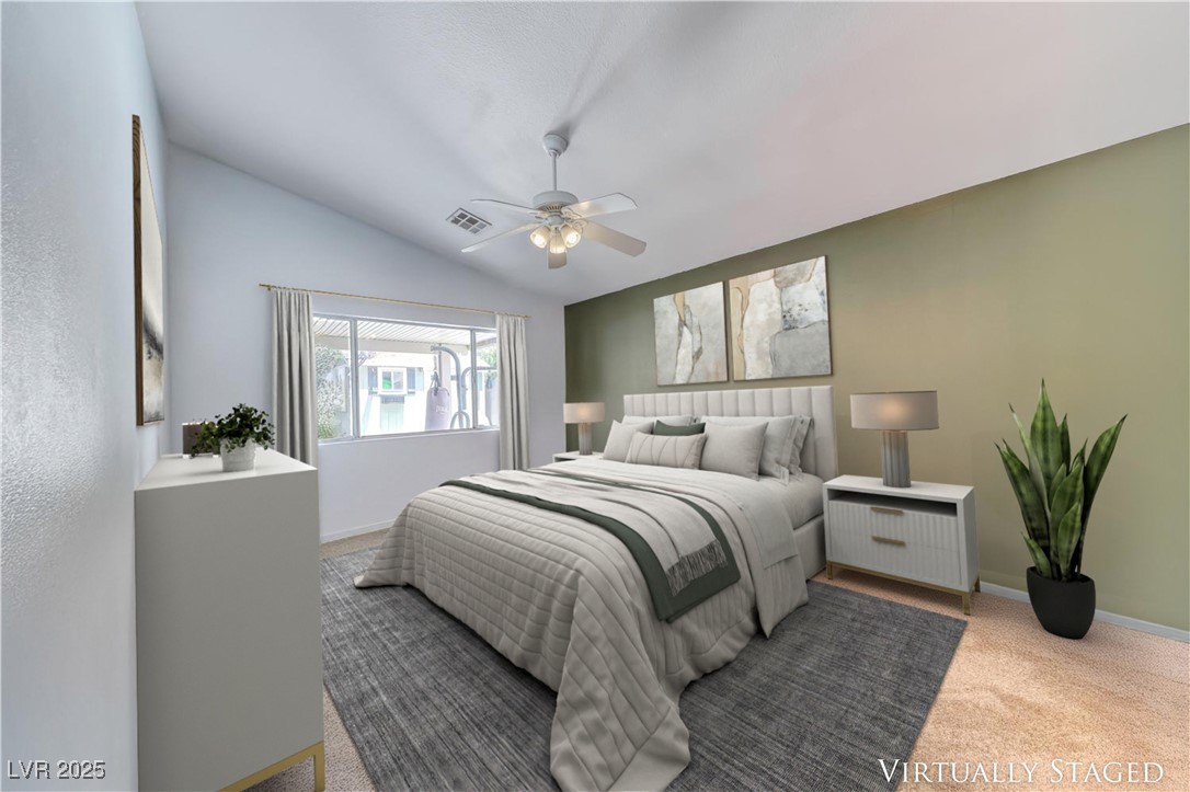 990 Ridge Path Avenue Henderson, NV 89015 - Photo 5 of 41 Bedroom featuring carpet, vaulted ceiling, and a ceiling fan