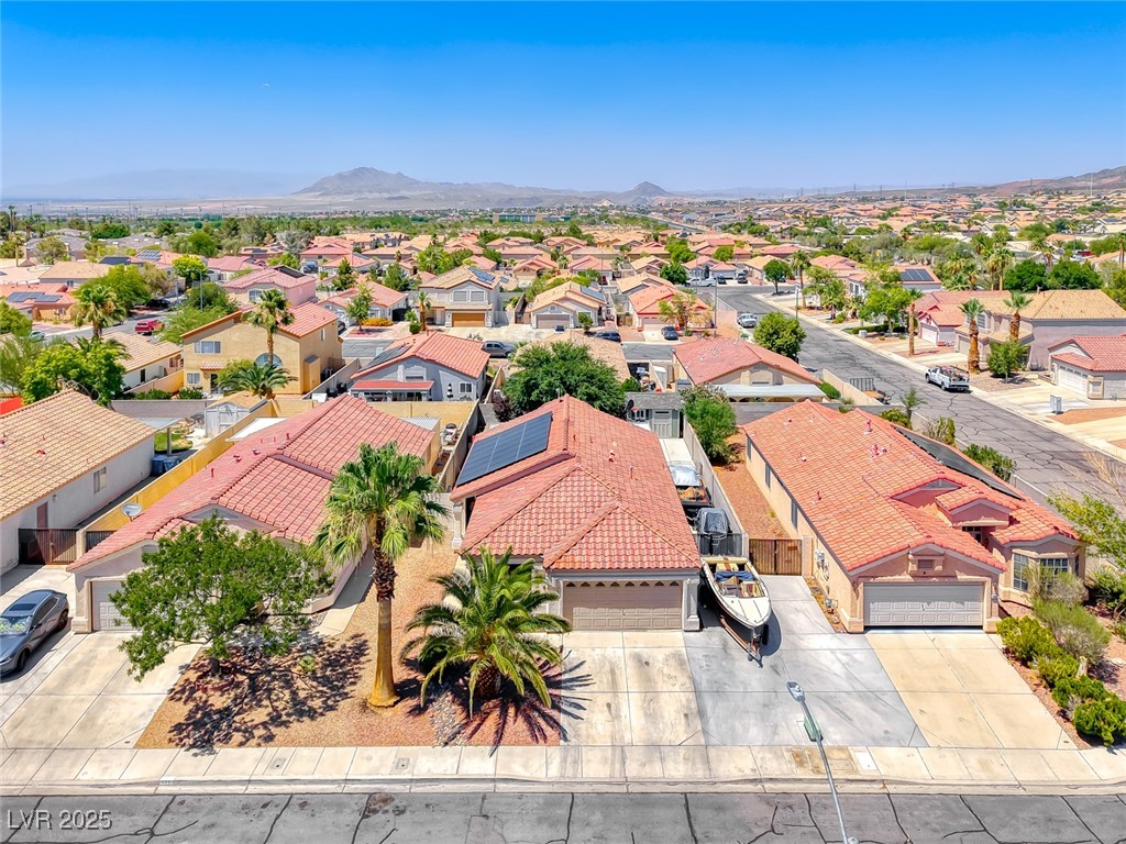 990 Ridge Path Avenue Henderson, NV 89015 - Photo 9 of 41 Aerial view of residential area with a mountain backdrop