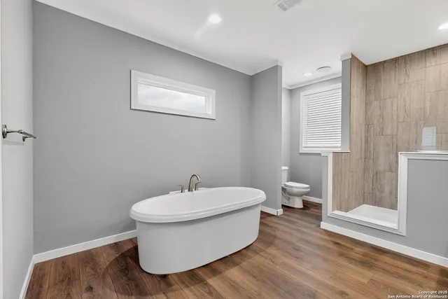 a bathroom with double sink and a mirror