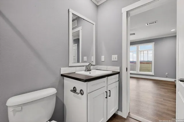 a bathroom with a sink a toilet and a bathtub