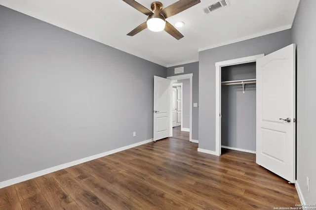 a kitchen with white cabinets and a sink