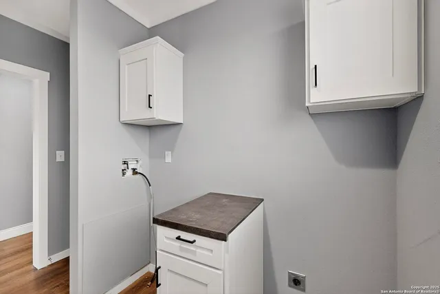 a bathroom with a sink and a window