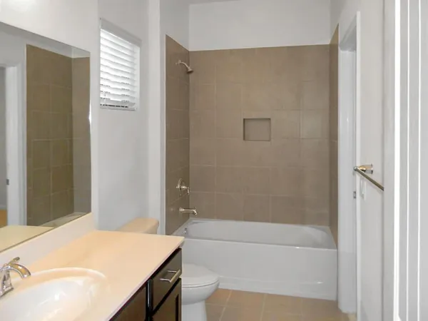 a bathroom with a bathtub and shower