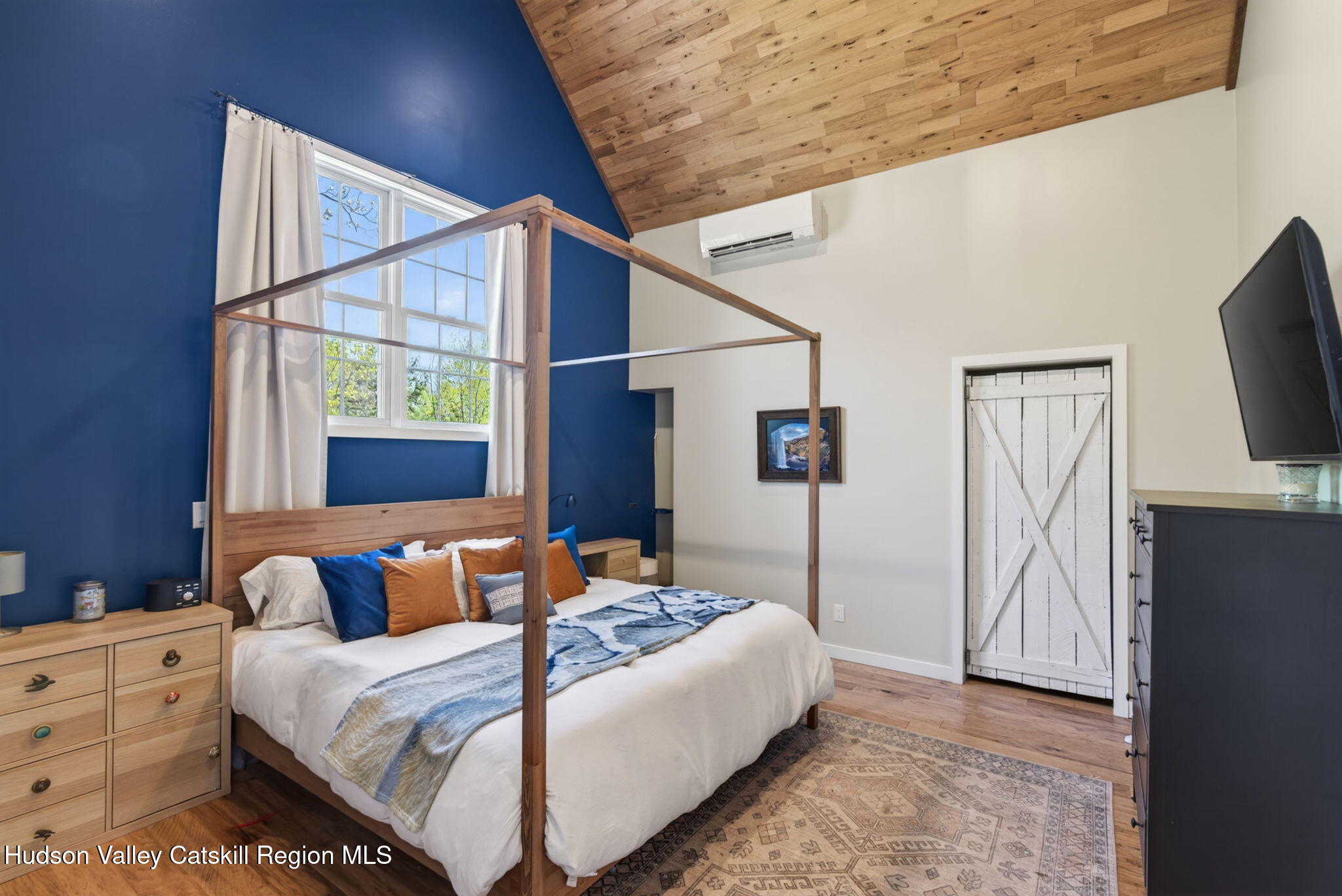 322 Morrison Road Acra, NY 12405 - Photo 17 of 49 a bedroom with a bed and a flat screen tv