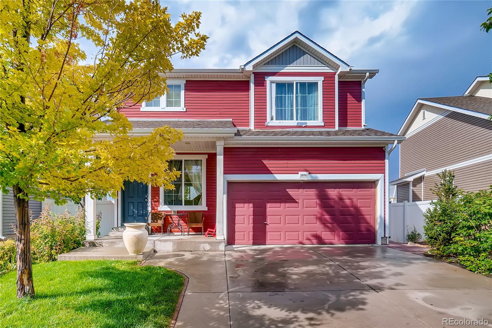 a view of a house with a yard and plants