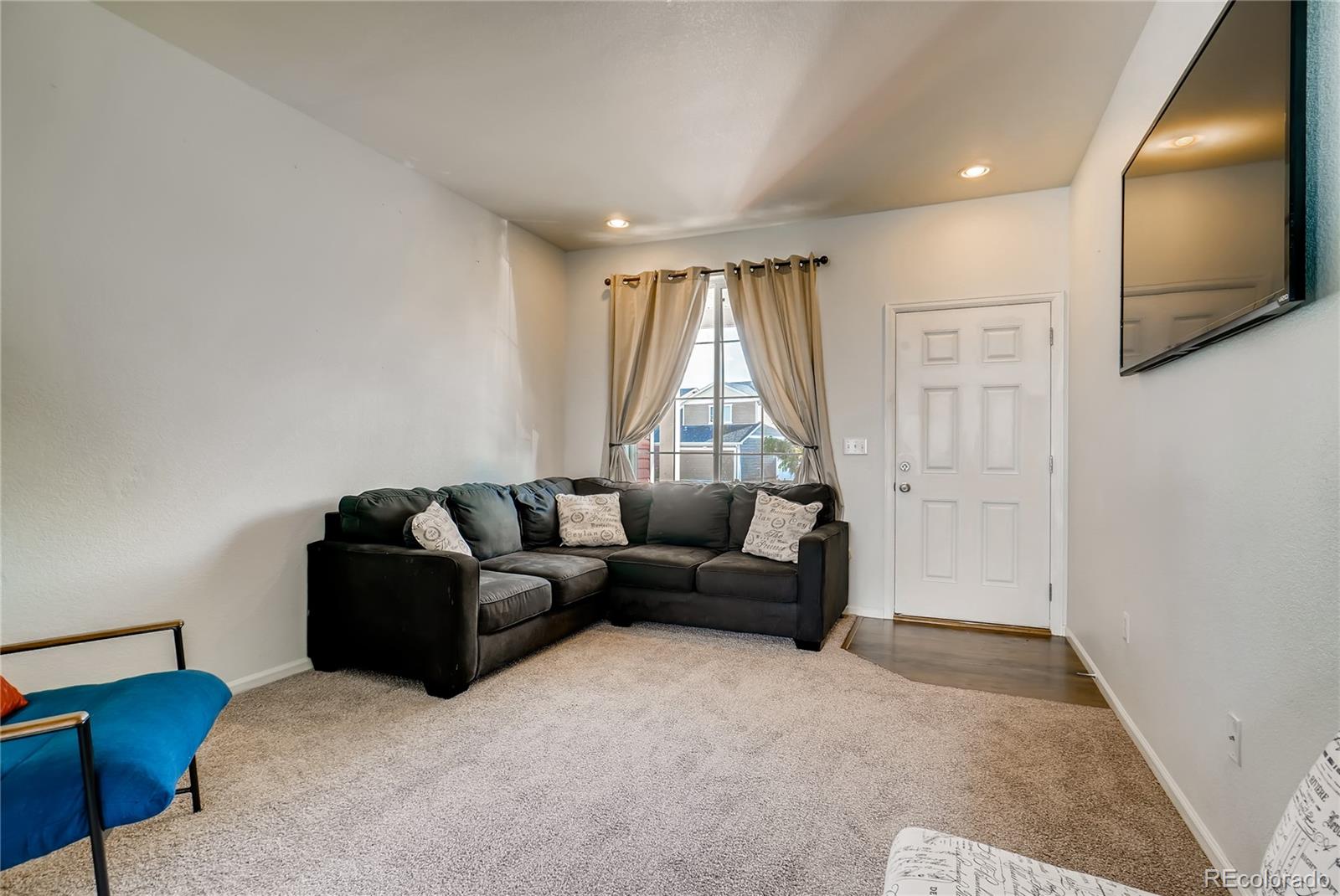 20761 Randolph Place Denver, CO 80249 - Photo 21 of 25 a living room with furniture and a window