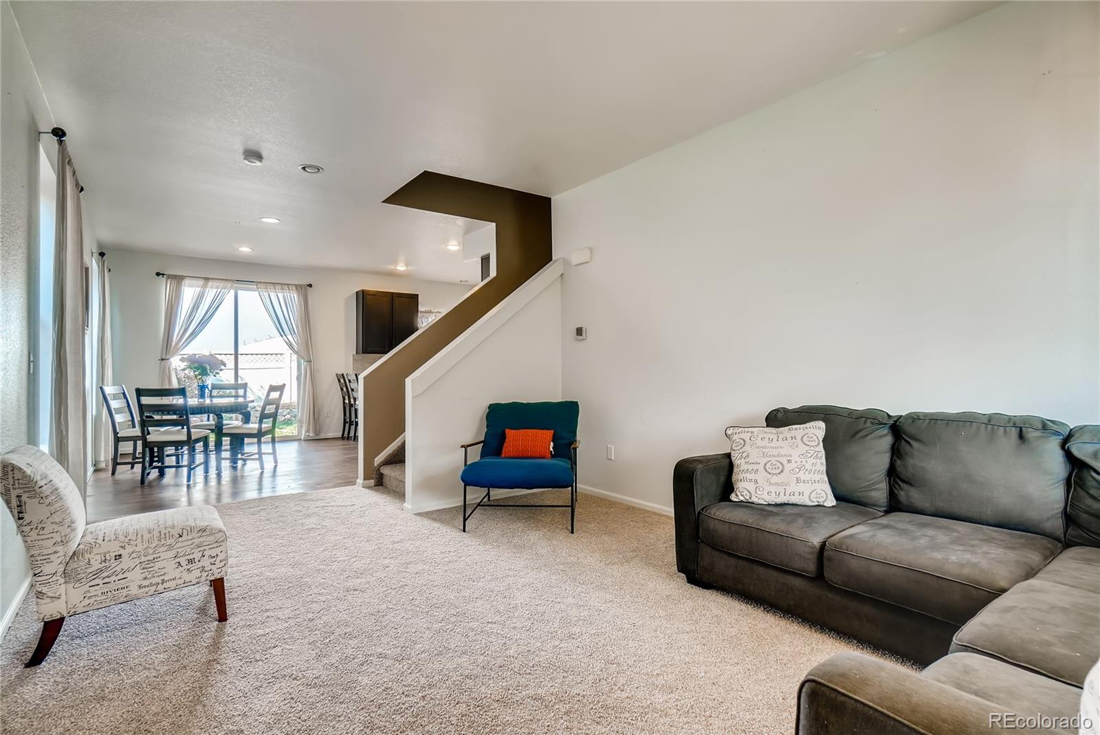 20761 Randolph Place Denver, CO 80249 - Photo 22 of 25 a living room with furniture and a large window