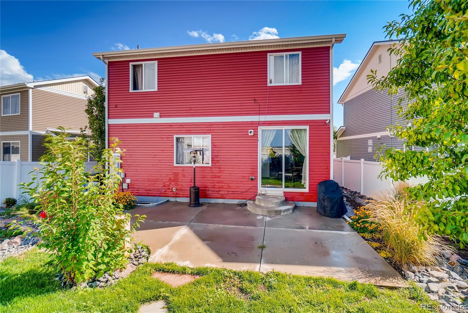 20761 Randolph Place Denver, CO 80249 - Photo 25 of 25 front view of a house with a yard