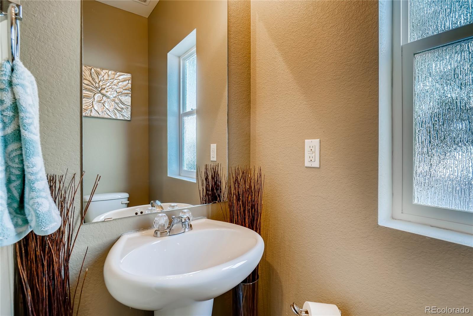 20761 Randolph Place Denver, CO 80249 - Photo 8 of 25 a bathroom with a sink and a mirror