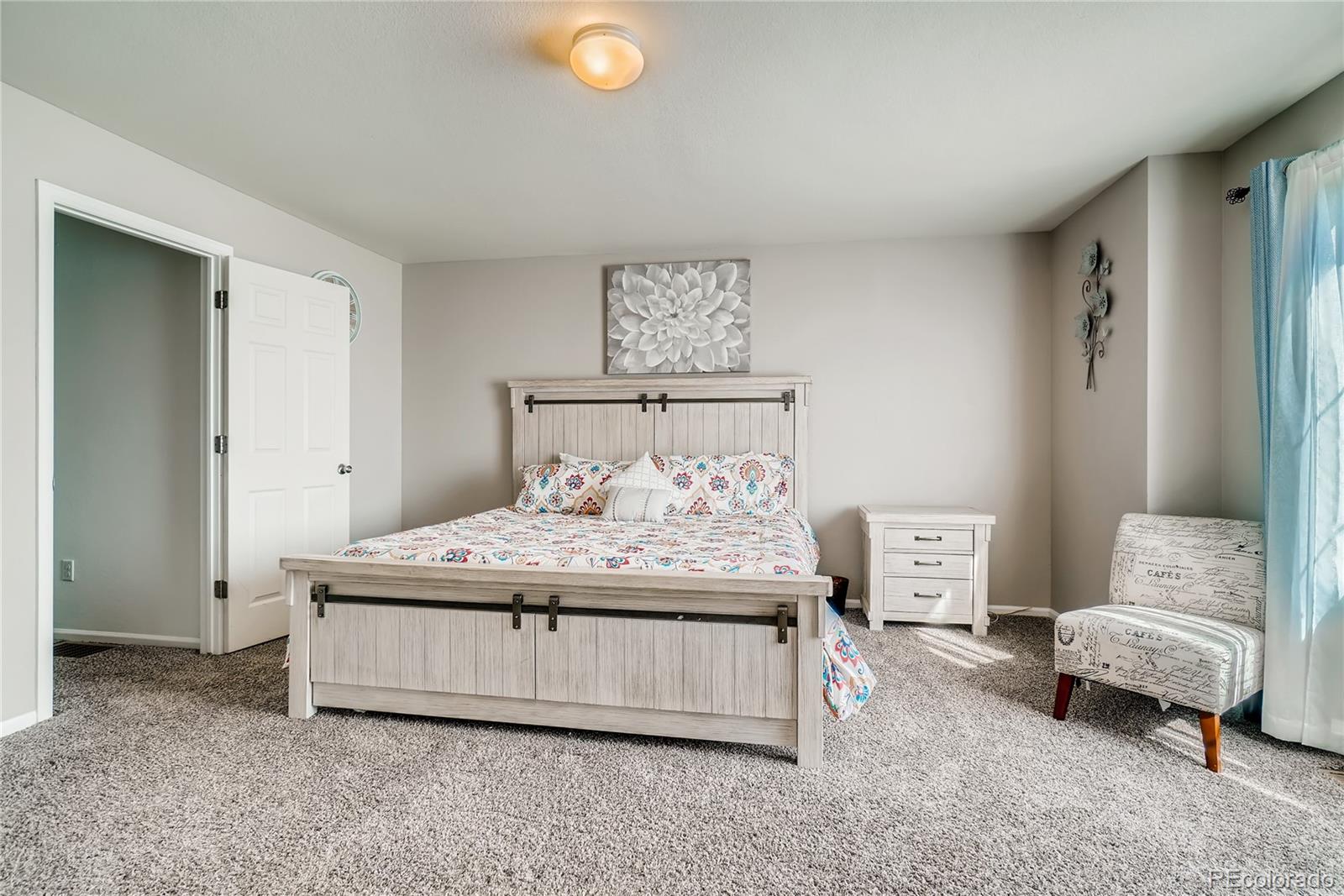 20761 Randolph Place Denver, CO 80249 - Photo 10 of 25 a bedroom with a bed and window