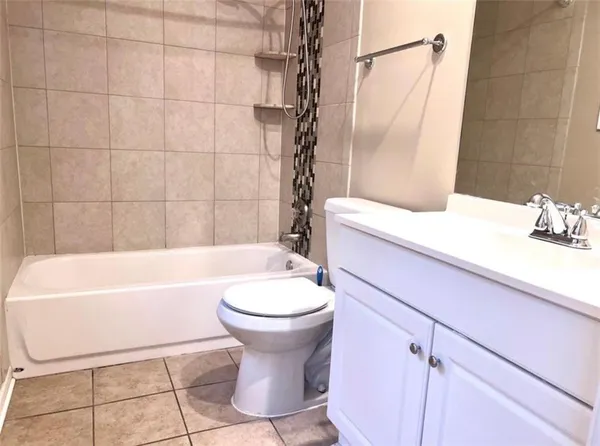 a bathroom with a sink a toilet and bathtub