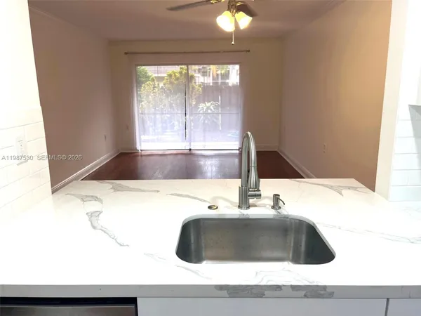 a bathroom with a sink and a large window