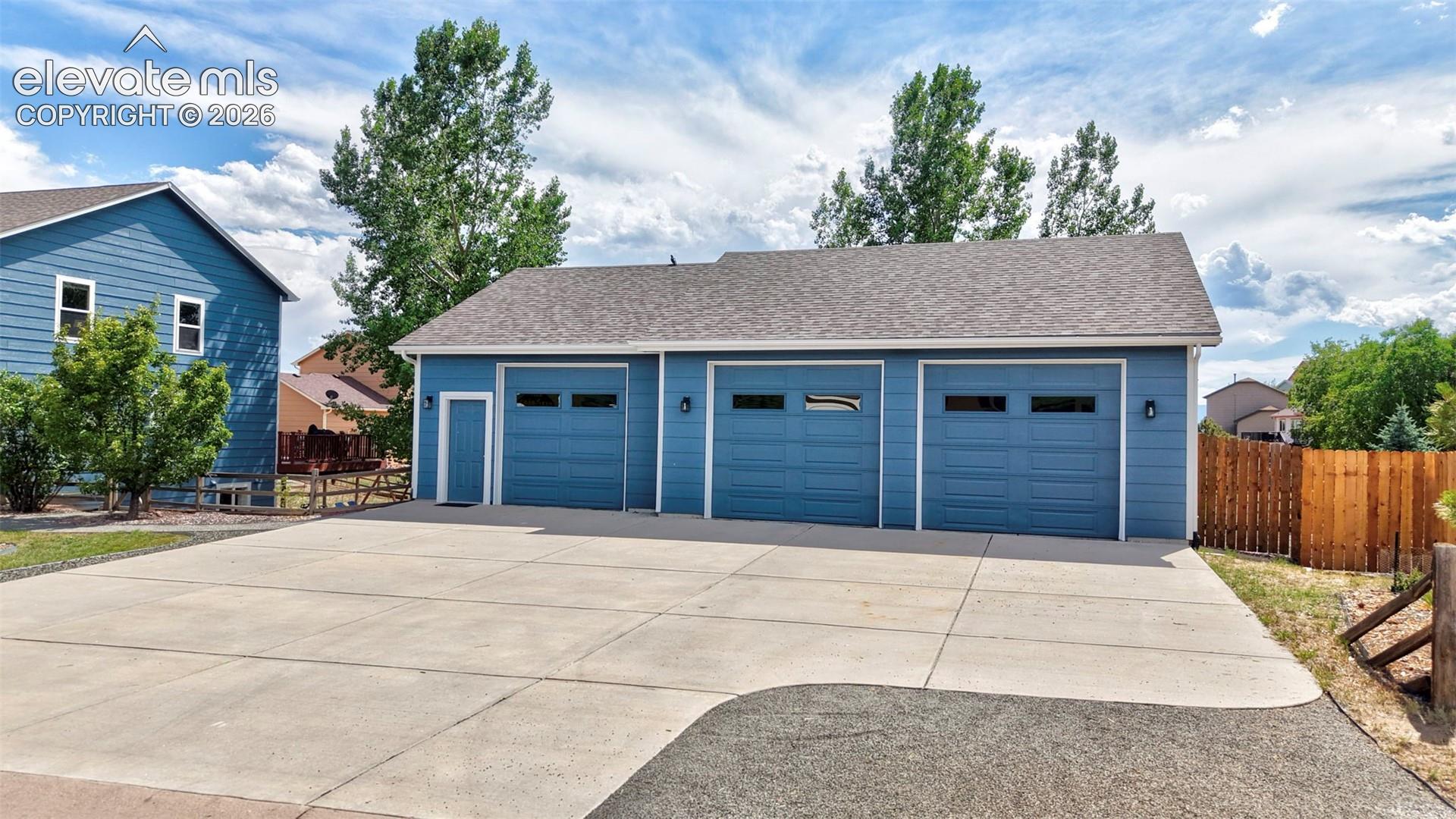 12571 Scamper Road Peyton, CO 80831 - Photo 3 of 49 Detached 3 car with it's own concrete driveway