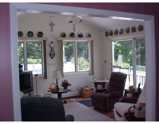 70 Proctor Road Chelmsford, MA 01824 - Photo 12 of 17 a living room with furniture and a large window