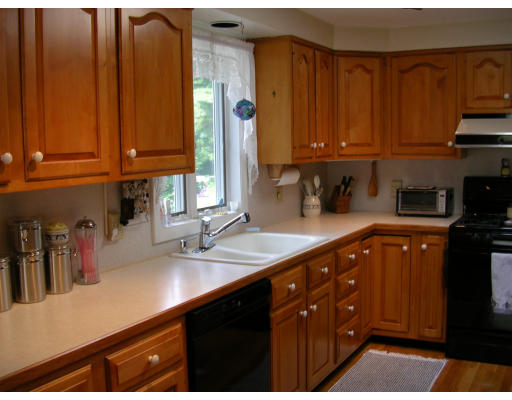 70 Proctor Road Chelmsford, MA 01824 - Photo 4 of 17 a kitchen with lots of counter top space and cabinets
