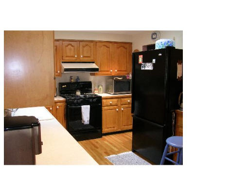 70 Proctor Road Chelmsford, MA 01824 - Photo 5 of 17 a kitchen with stainless steel appliances kitchen island granite countertop a refrigerator a stove and a microwave