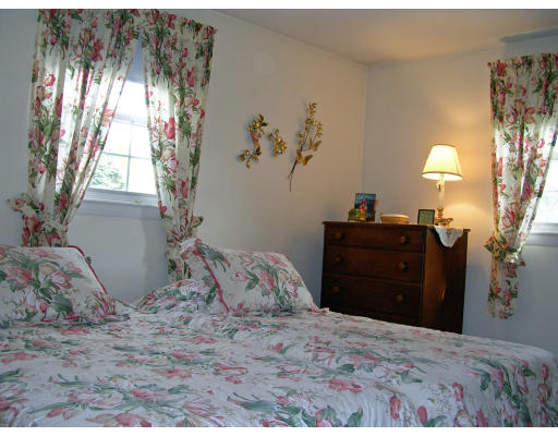 70 Proctor Road Chelmsford, MA 01824 - Photo 7 of 17 a bedroom with a bed and a window