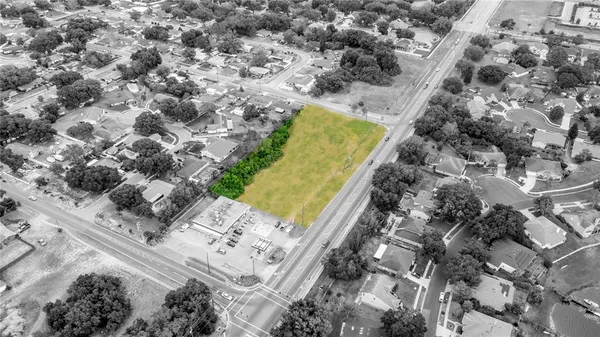 a aerial view of a house with a yard