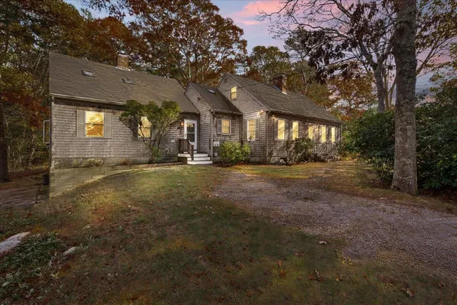 a bathroom with a sink a window and a shower