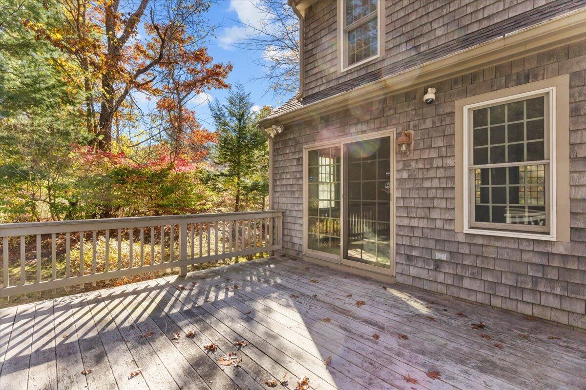 515 County Road Pocasset, MA 02559 - Photo 15 of 66 a view of a brick house with large windows