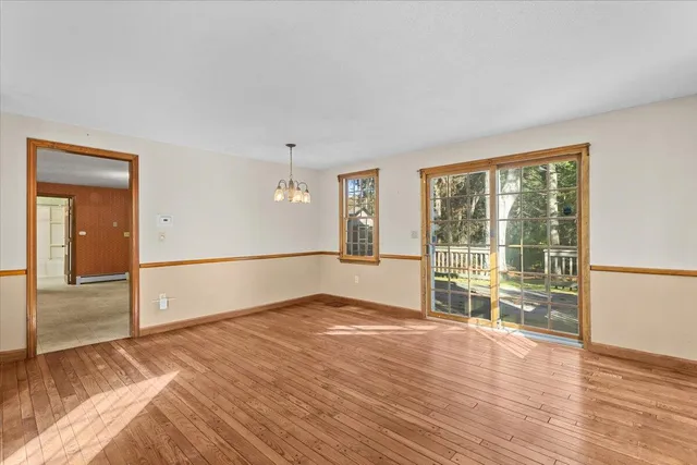 a bathroom with a granite countertop sink and a toilet