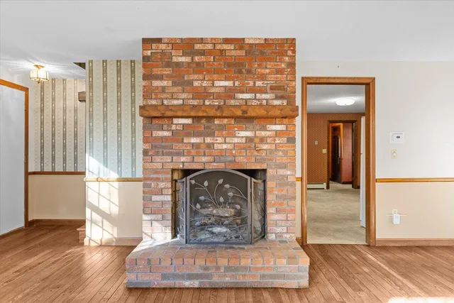 a view of an empty room and a window