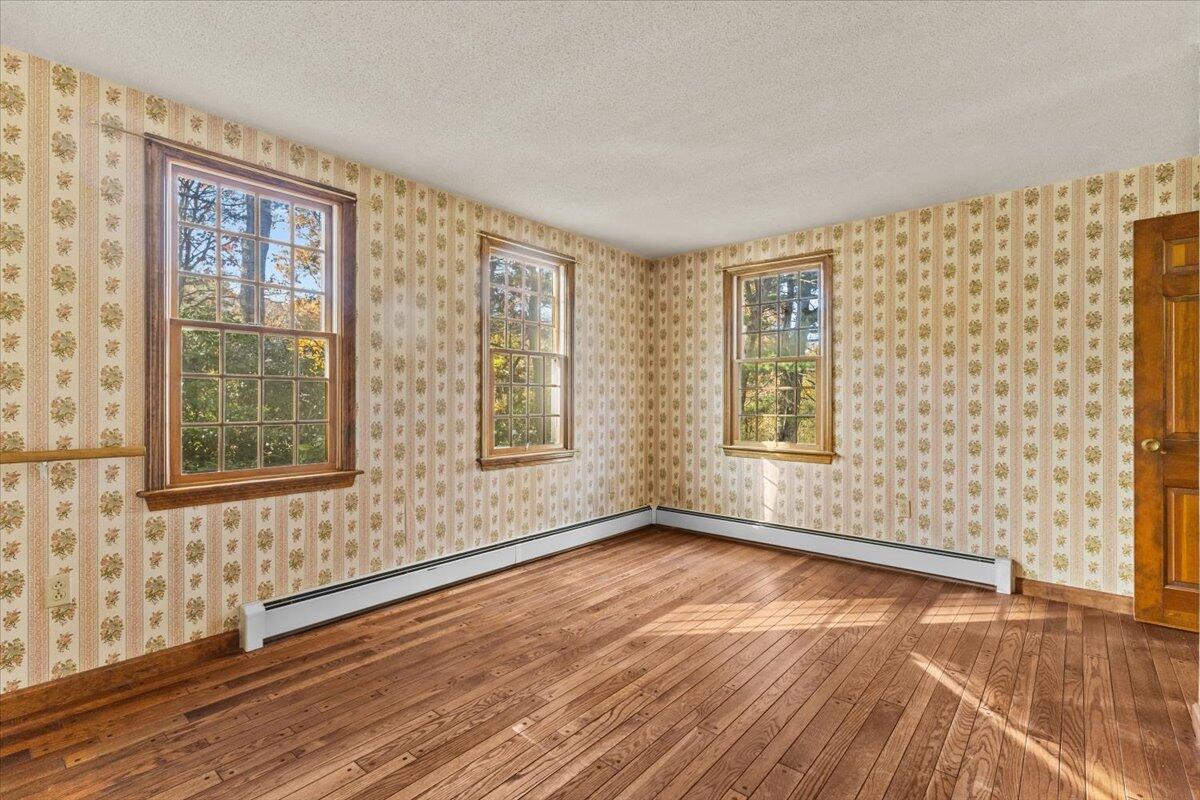515 County Road Pocasset, MA 02559 - Photo 35 of 66 a view of an empty room with a window and wooden floor