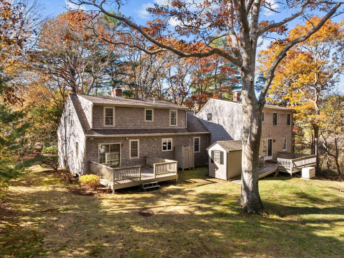 515 County Road Pocasset, MA 02559 - Photo 4 of 66 a front view of a house with a yard
