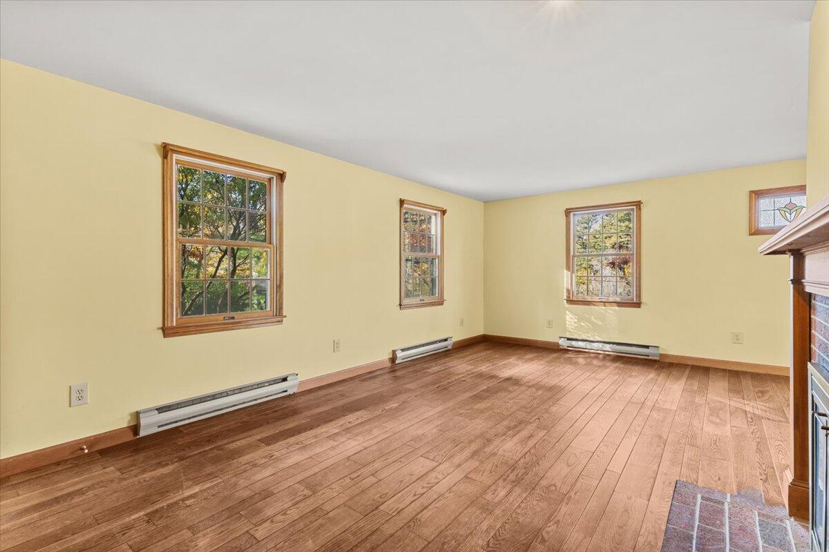515 County Road Pocasset, MA 02559 - Photo 48 of 66 a view of an empty room with window and wooden floor