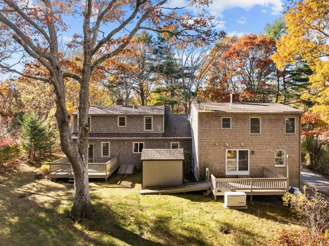 a view of the house with a yard