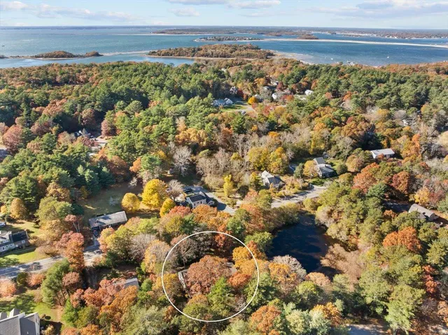 a view of a brick house with large windows