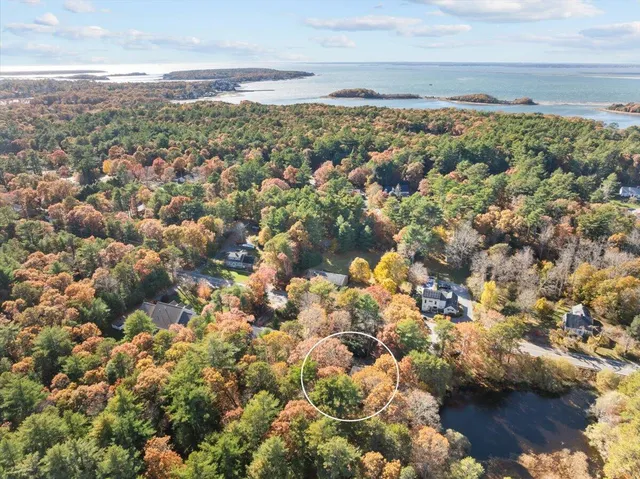 a view of a brick house with large windows