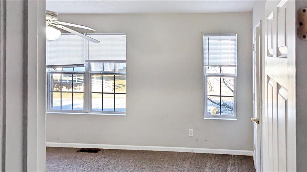 5737 Strathmoor Manor Circle Lithonia, GA 30058 - Photo 11 of 14 a view of an empty room with a window