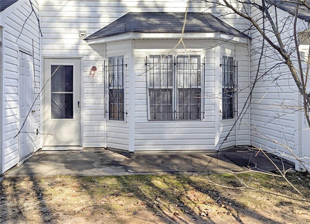 5737 Strathmoor Manor Circle Lithonia, GA 30058 - Photo 14 of 14 a view of a house with a yard